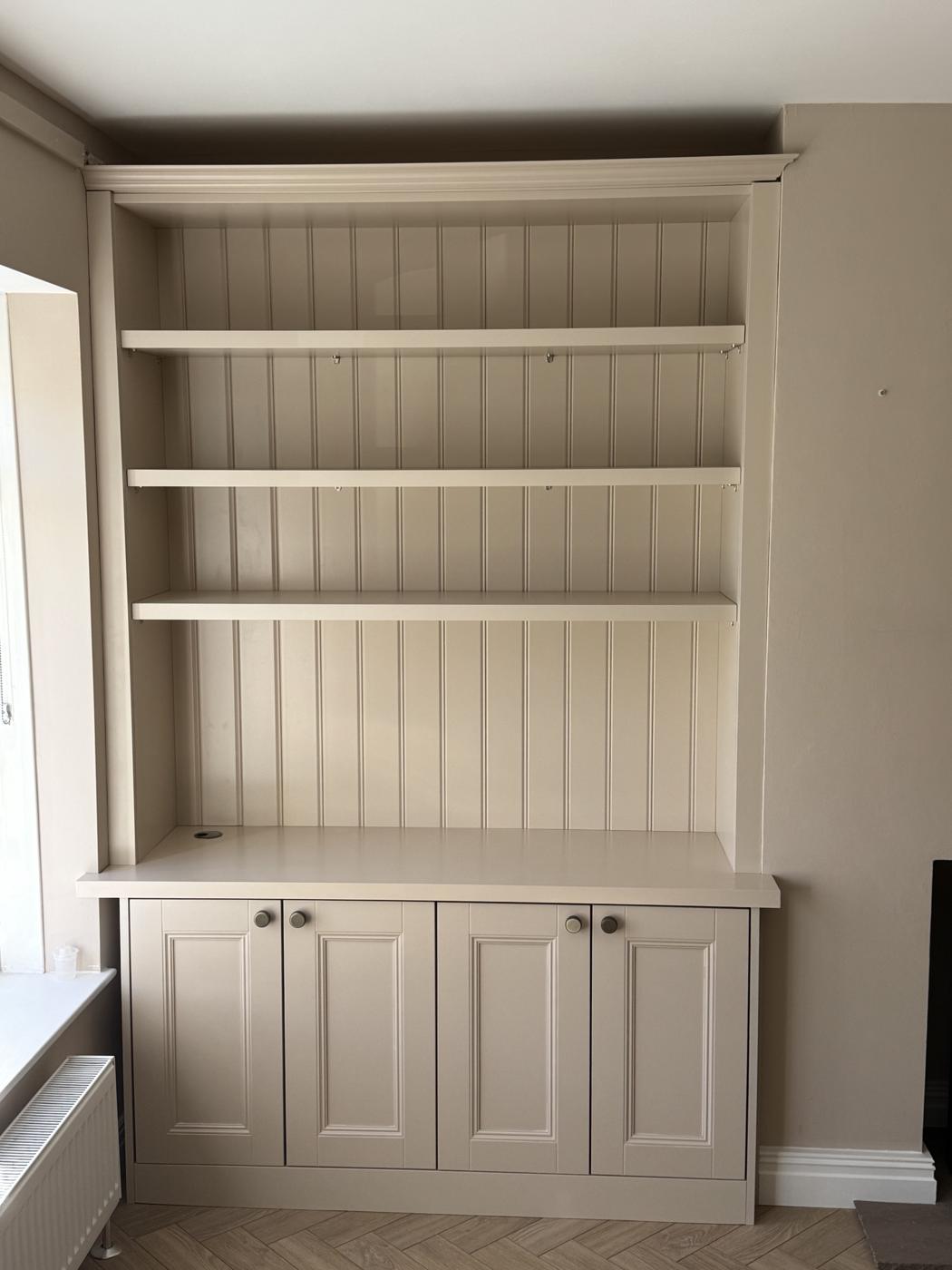 Painted alcove unit with tongue and groove back panel, open shelves and cupboards below